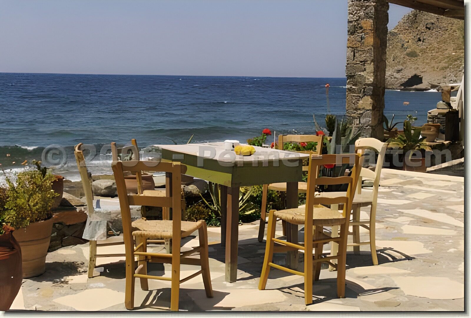 WCUK35779: Italian panoramic view over the sea with old table,and chairs