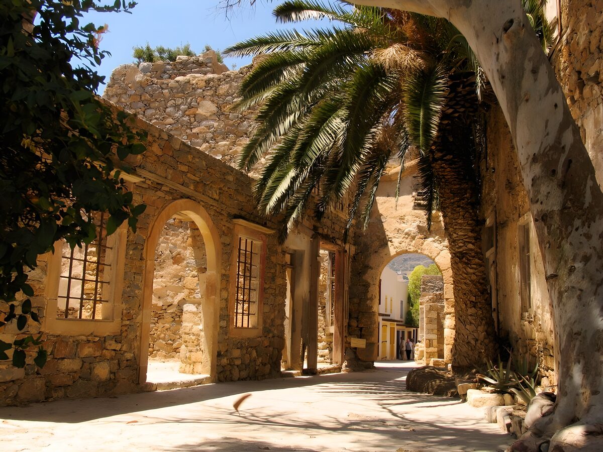 Old Greek alley way with palm tree