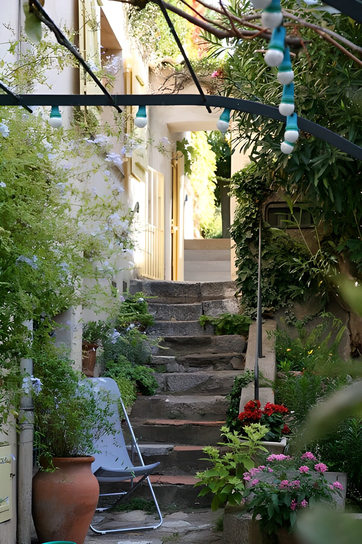 WCUK67505: Steps to house entrance with lights and chair