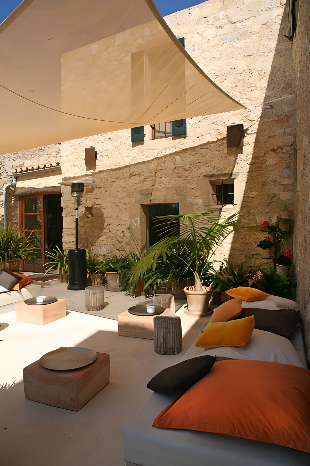 WCUK59896: Corner of the lounge situated in the patio of house, with cushions
