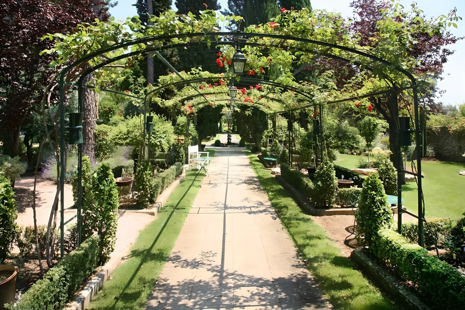 WCUK84948: Roses arch in French garden version 2