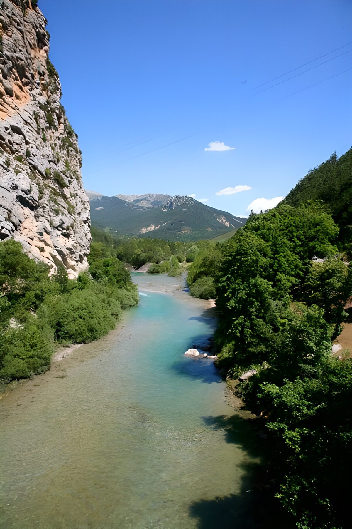 WCUK44246: River cutting through mountian pass, vegetation along the edge.