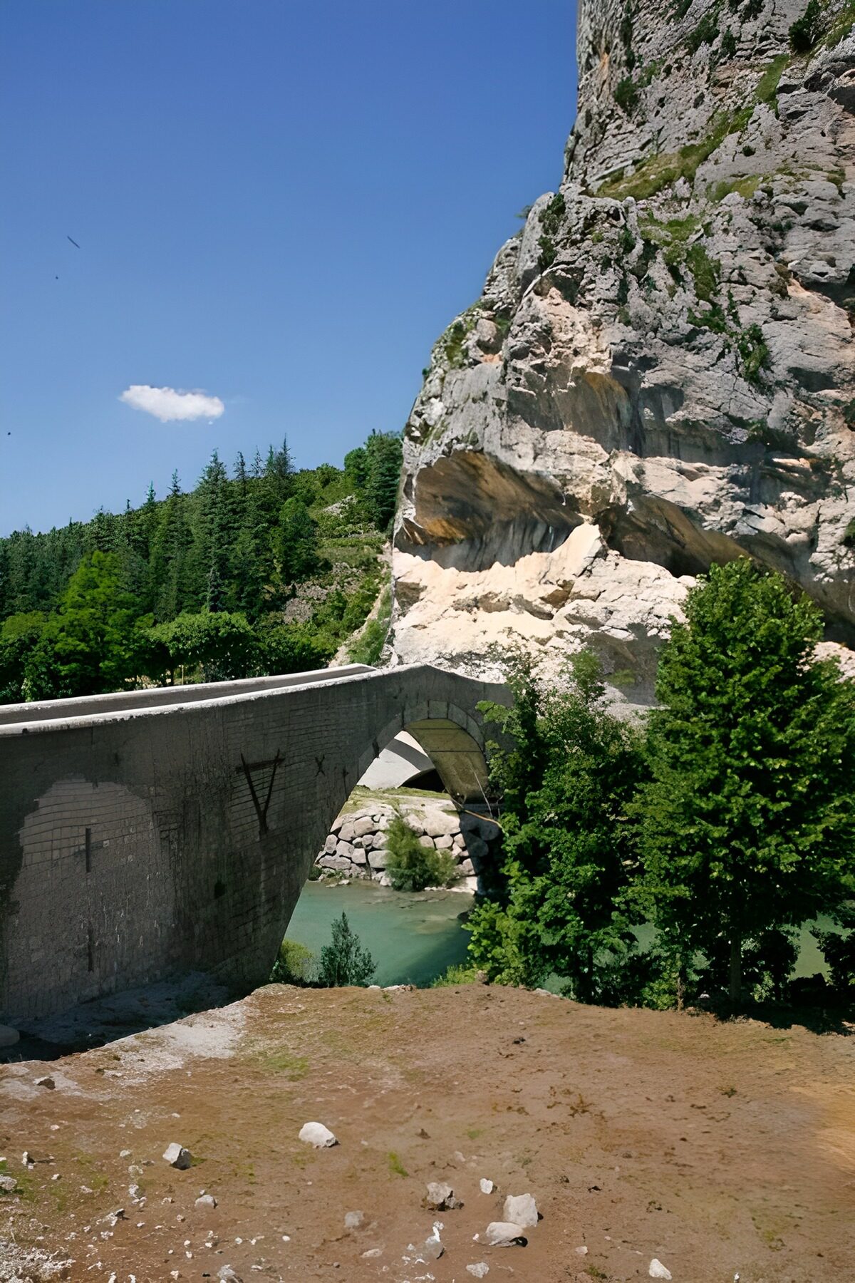 WCUK38402: Arched bridge over mountain river